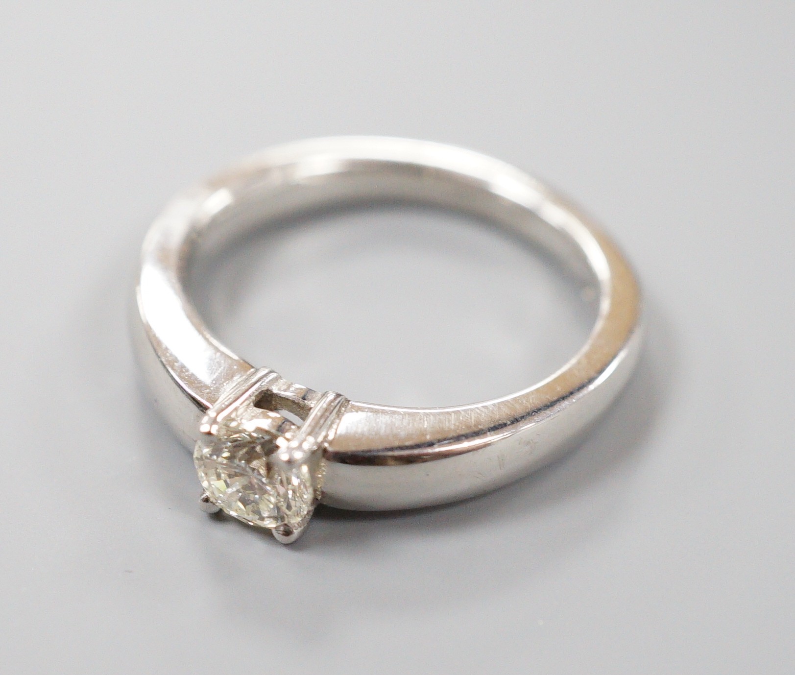 A modern platinum and solitaire diamond ring, size M, gross weight 8.7 grams